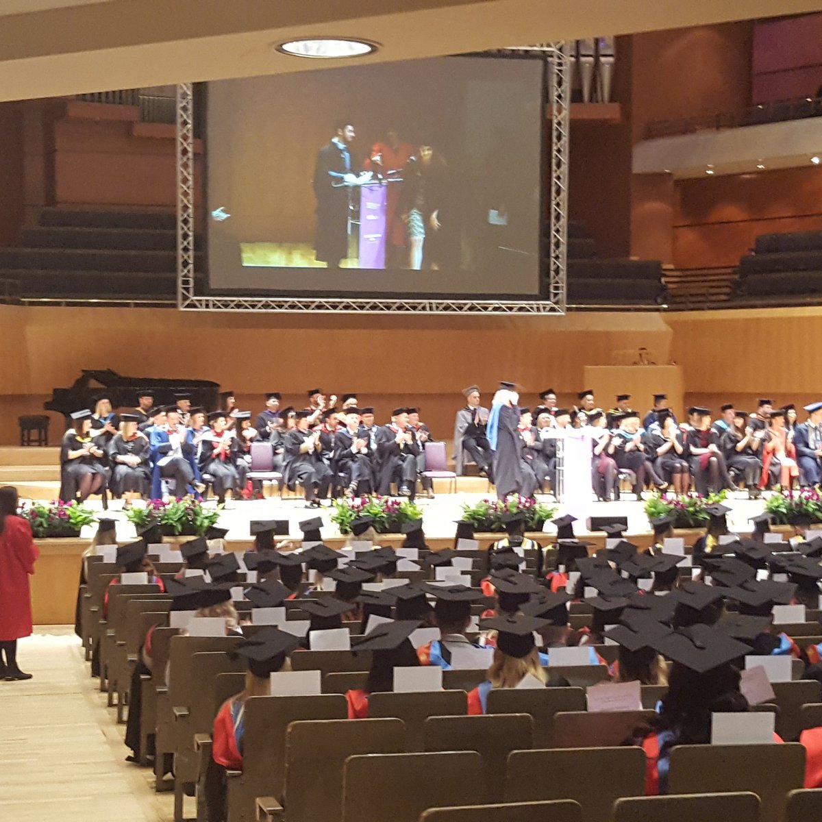 TheMcrCollege's tweet photo. Now it's time for our graduates to take to the stage. #tmcgrad2017 https://t.co/wwZoWNMZAu