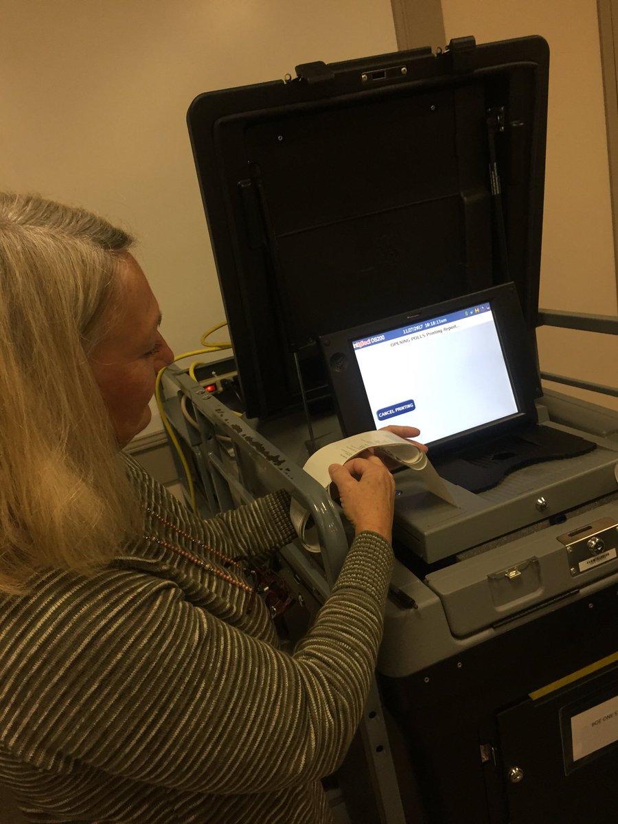 Poll worker Evelyn Harris runs zero tape opening the polls for today’s MHC and PKS recount. #carteretelects