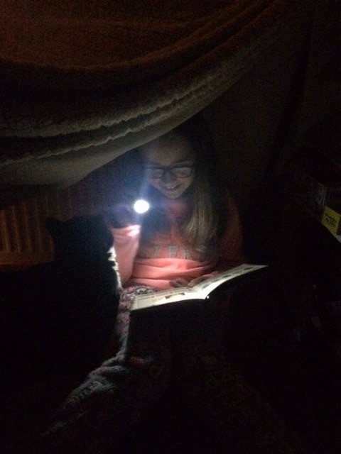 WBurghPrimary's tweet photo. Mirin reading a book by torchlight and reading a book she loved as a child. #ReadingDares for #BookWeekScot #WillybugReads Thank you for getting involved. https://t.co/SC6OuTTgXH