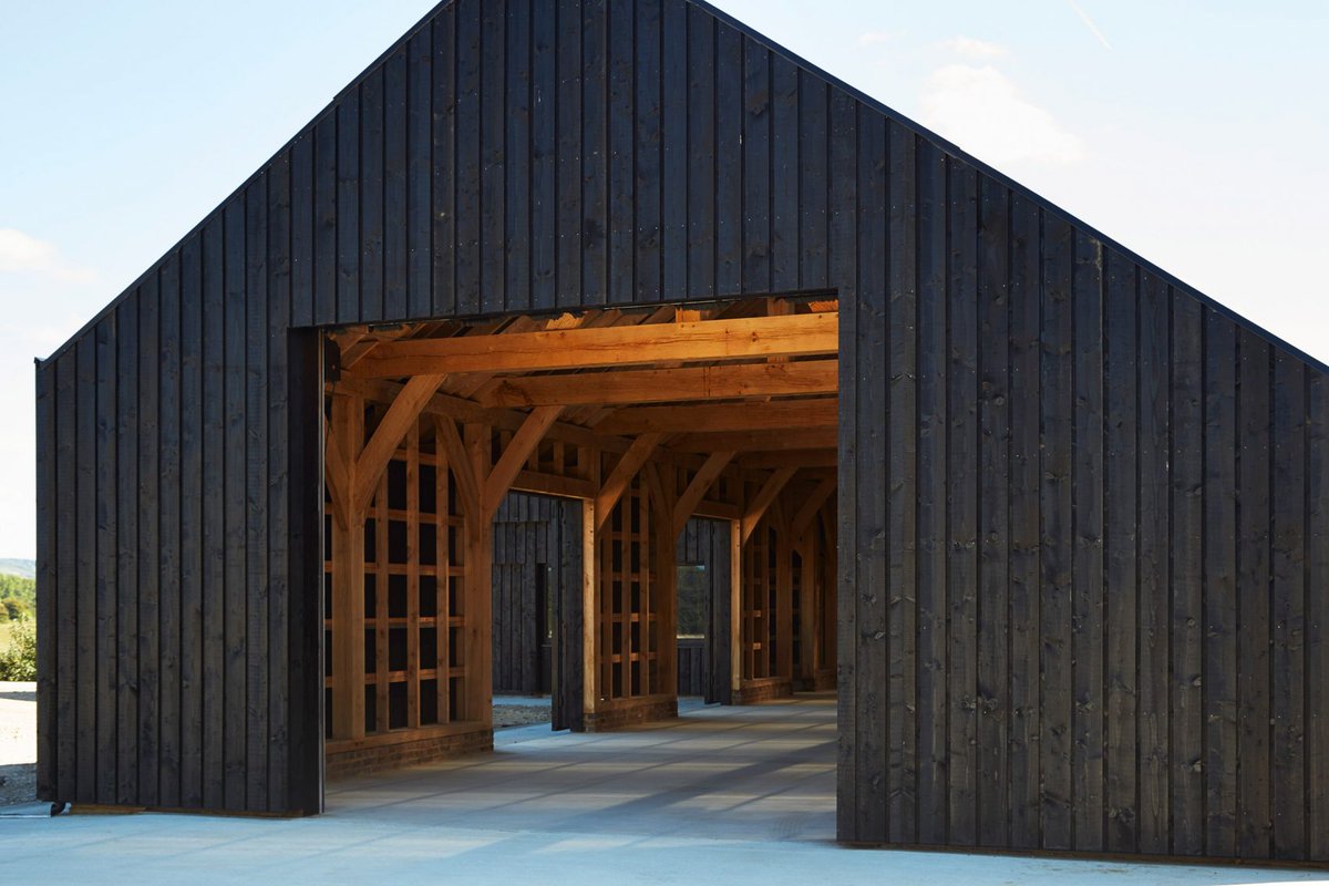 RIBA's tweet image. Black barn built by RIBA Chartered Practice @macdonaldwright at Caring Wood country house via @Dezeen bit.ly/2B6jY47 #architecture