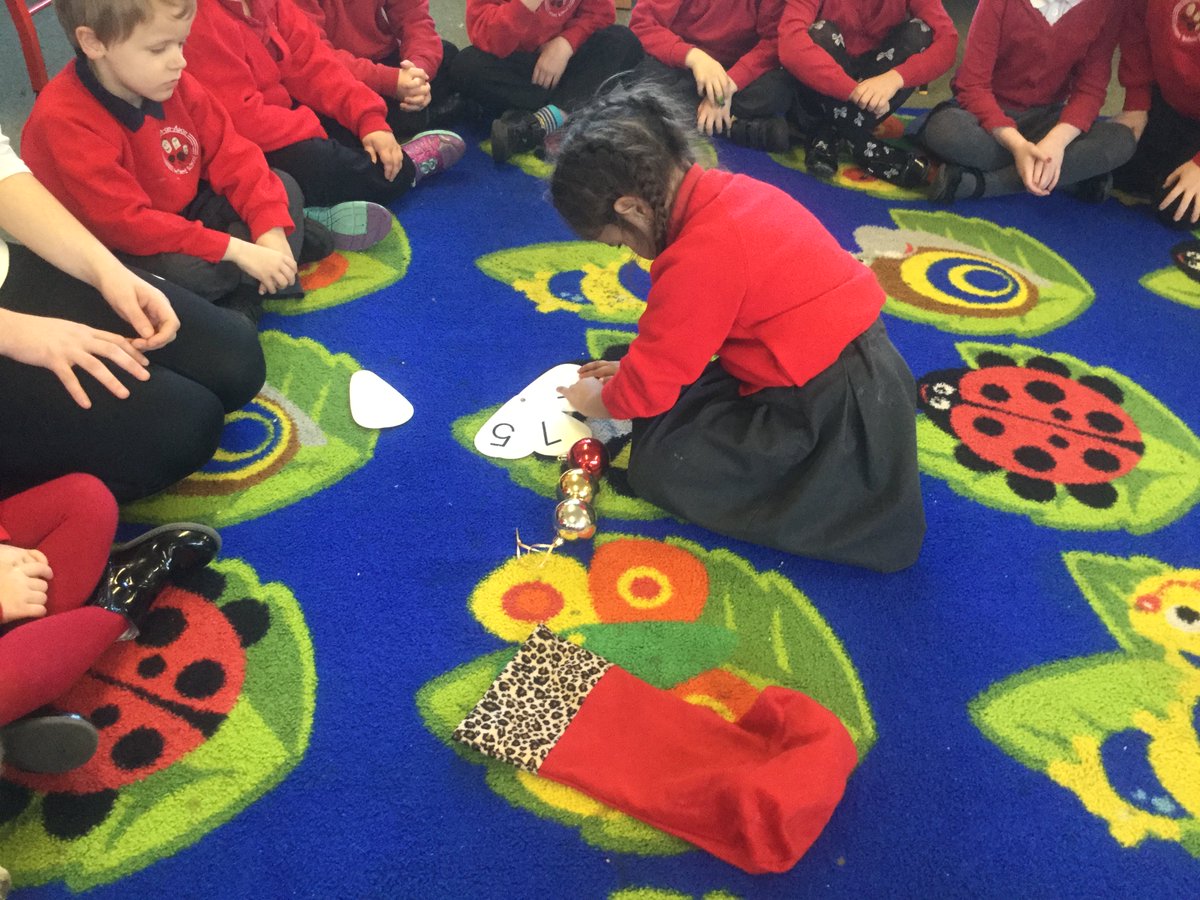 ashclass_TIS's tweet photo. Christmas themed addition! We counted the baubles in each stocking, matched to the numeral, then added them together #EYtalking https://t.co/0lisW01j9Q