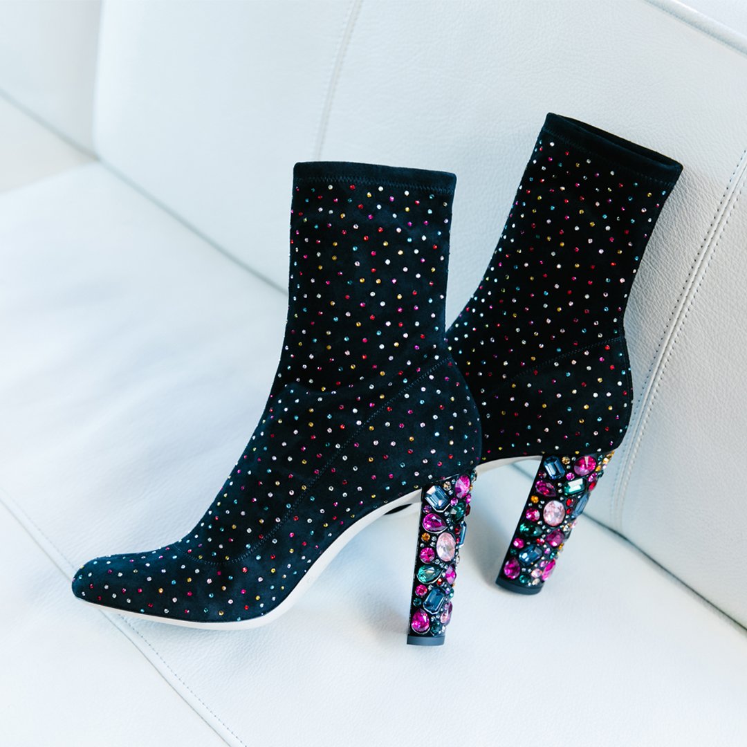 jimmychoo's tweet photo. Turn heads this party season with MAINE, the classic bootie with disco attitude, in black suede featuring multi scattered crystals and a show-stopping gem heel. https://t.co/59c188E2EG https://t.co/FspjN8GId4