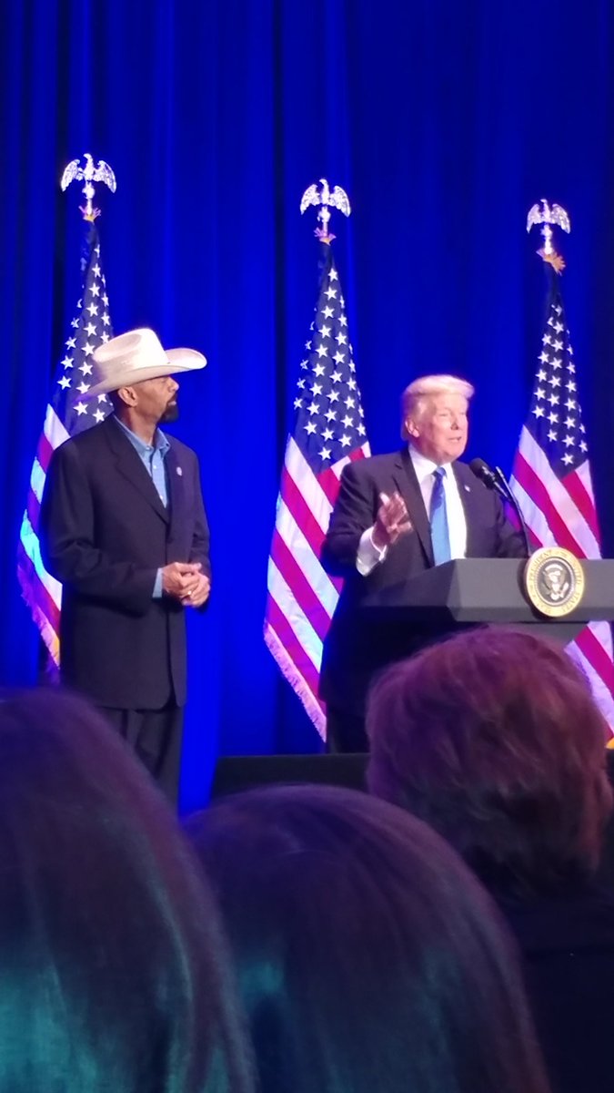 SheriffClarke's tweet photo. SERIOUSLY? I mean really? This smear artist wants you to believe that @realDonaldTrump has a fear of tall black men. If he does then POTUS must have had a case of amnesia as he invited me on stage with him in Dallas several weeks ago. I'm 6'4" 205lbs. https://t.co/cjoME70tgP https://t.co/KhpSpglibF
