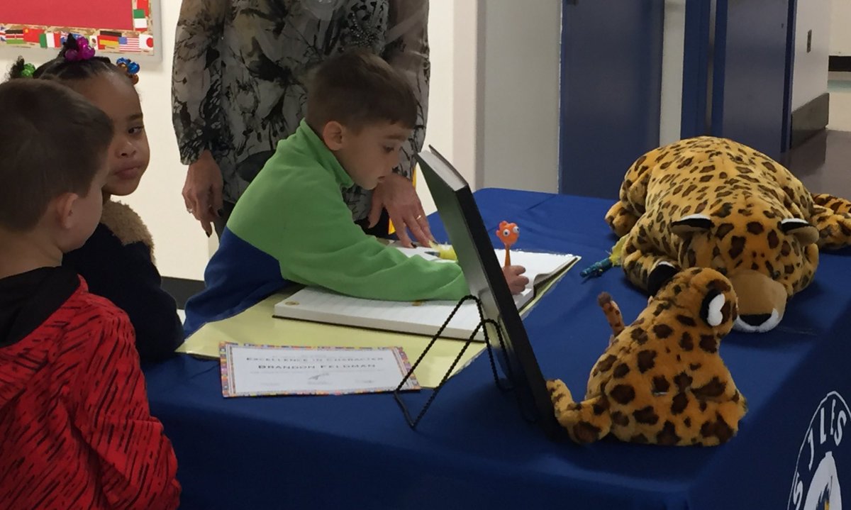 Recognition in Learning, Leadership, Character, &amp; the Arts. Students sign the Book of Amazing Achievements! #SJLESproud