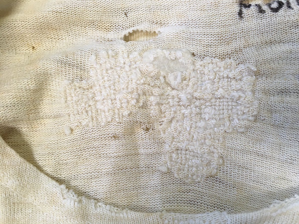 Championwonder's tweet photo. Major darning action on ww2 vest and long johns! #textileconservation #liddlecollection #makedoandmend #brothertonspecialcollections https://t.co/ZLFbxj1QnX