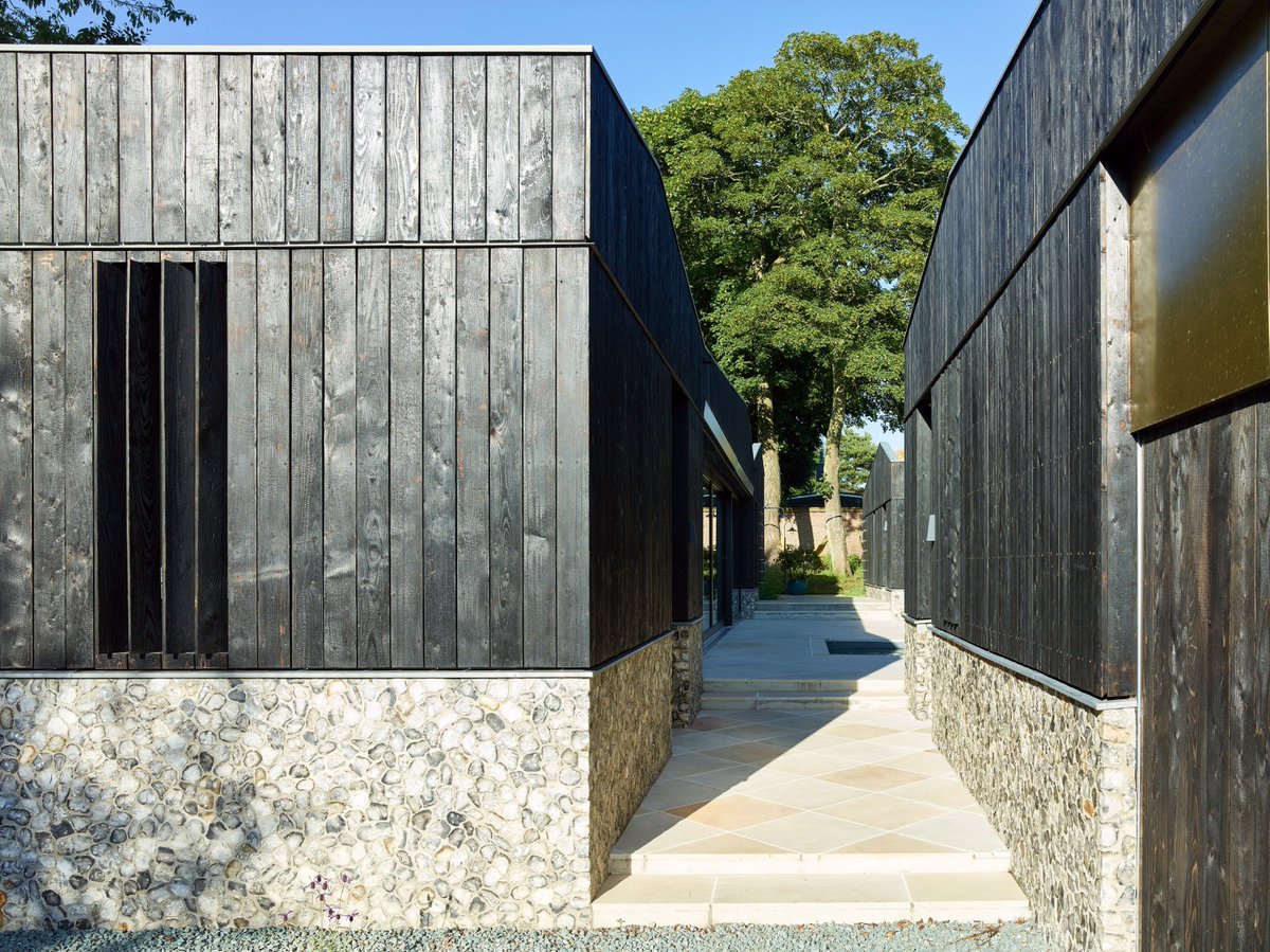 RIBA's tweet photo. Made up of three barn-like buildings which surround a tranquil outside courtyard and conceal a series of extraordinary spaces, Peacock House (Flints) on the Suffolk coast was designed by Swiss-based practice BHSF Architekten with London’s Studio-P @GrandDesigns #HouseOfTheYear https://t.co/yKVKLgGftG