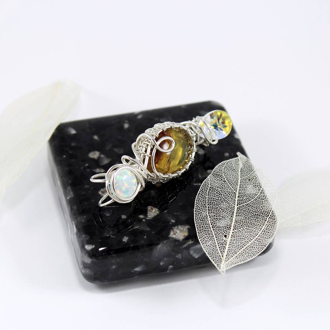 SoulFireAlchemy's tweet photo. Sneak peek of our first #DoubleBail pendant ♡
(1 3/4" tall. Amber, Swarovski Crystal &amp; simulated Opal)
#Jewelry #VailValley https://t.co/rb6pIfb7Tj