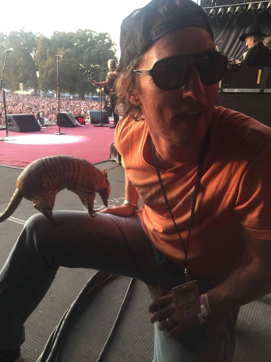 TexasHumor's tweet photo. You may be Texan, but you'll never be as Texan as Matthew McConaughey with an Armadillo at a Willie Nelson Concert. https://t.co/UasZHLDD9Q