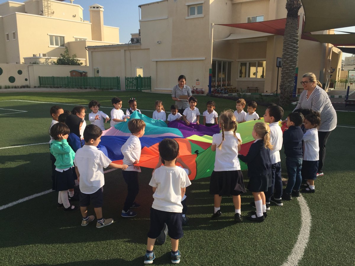 AWISDoha's tweet photo. Our FS1 students have started their day by having fun with the parachute #AWISLearningCommunity #PEfun #teamwork #developingcoordination #cooperationskills https://t.co/1IyjAnrOhP