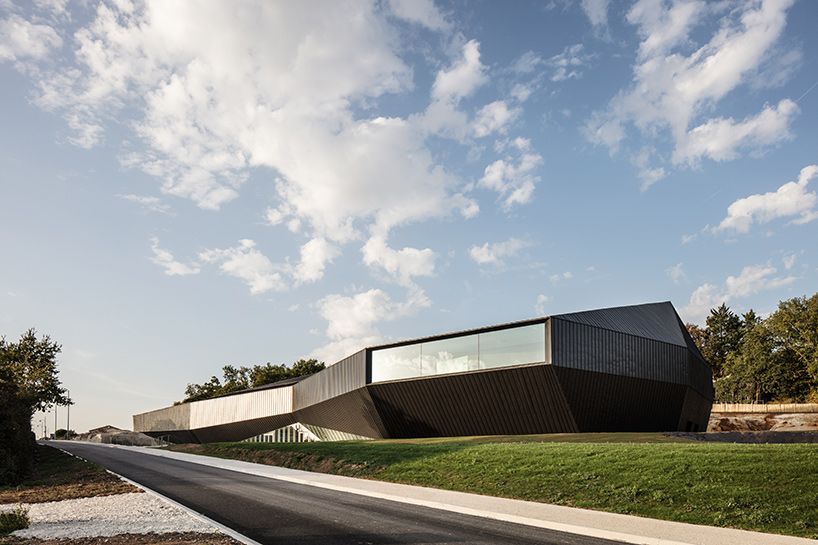 designboom's tweet photo. tetrarc embeds monolithic convention center into the landscape of southwestern france https://t.co/fFiESot1gr https://t.co/53xIgTGj2D