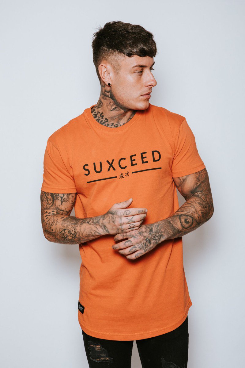 71_Q's tweet photo. NEW! Suxceed 'fire' Tshirt has got to be part of anyone's wardrobe leading up to Xmas.

More about this product:

- Orange Tshirt

- Suxceed Logo across the Chest

- Fitted Longline Top

- Model is 5'9 wearing Medium
---
https://t.co/pym8pqQuu4
---
#fashion #winner #branding https://t.co/0UPCTATGLg