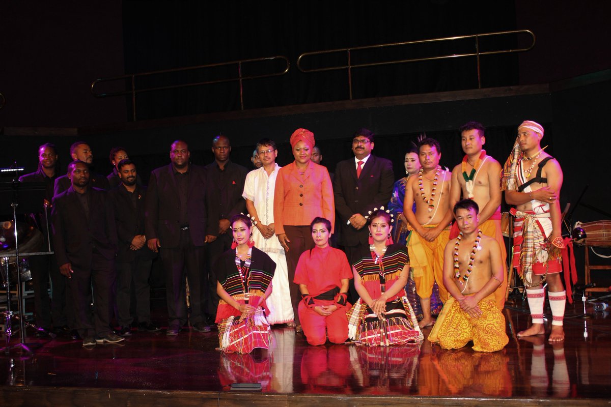 IndiainTandT's tweet photo. #RhythmsOfManipur & #TheNationalSteelSymphonyOrchestraOfTrinidadAndTobago pose with his Excellency, Mr. Bishwadip Dey, #HighCommissionerOfIndia Trinidad and Tobago & the Honourable Dr. Nyan Gadsby-Dolly, Minister of Community Development, Culture & the Arts of #TrinidadAndTobago https://t.co/kDD4RIYzM3
