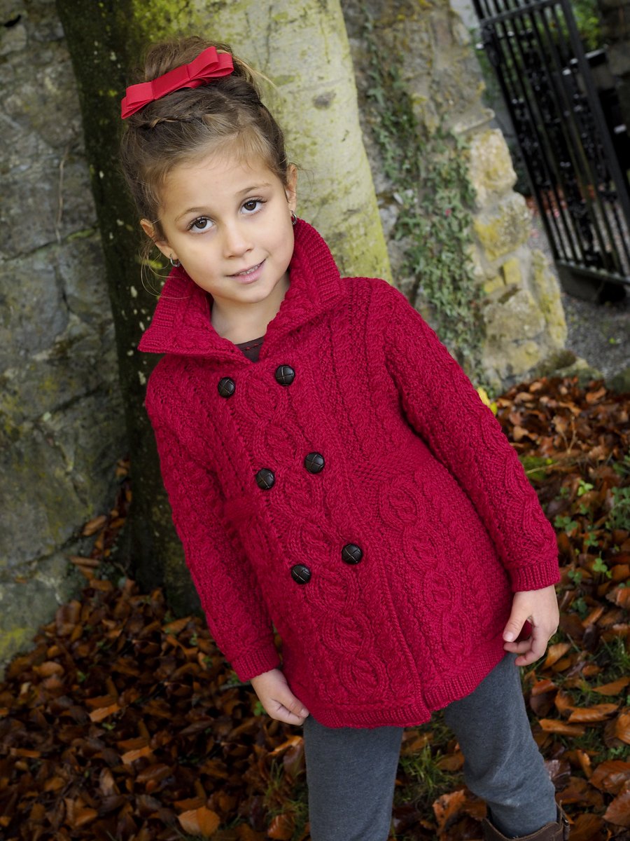 Beautiful girls double-breasted cardigan with football buttons. Made with a combination of traditional Irish stitches. Warm and stylish. bit.ly/2hr771J