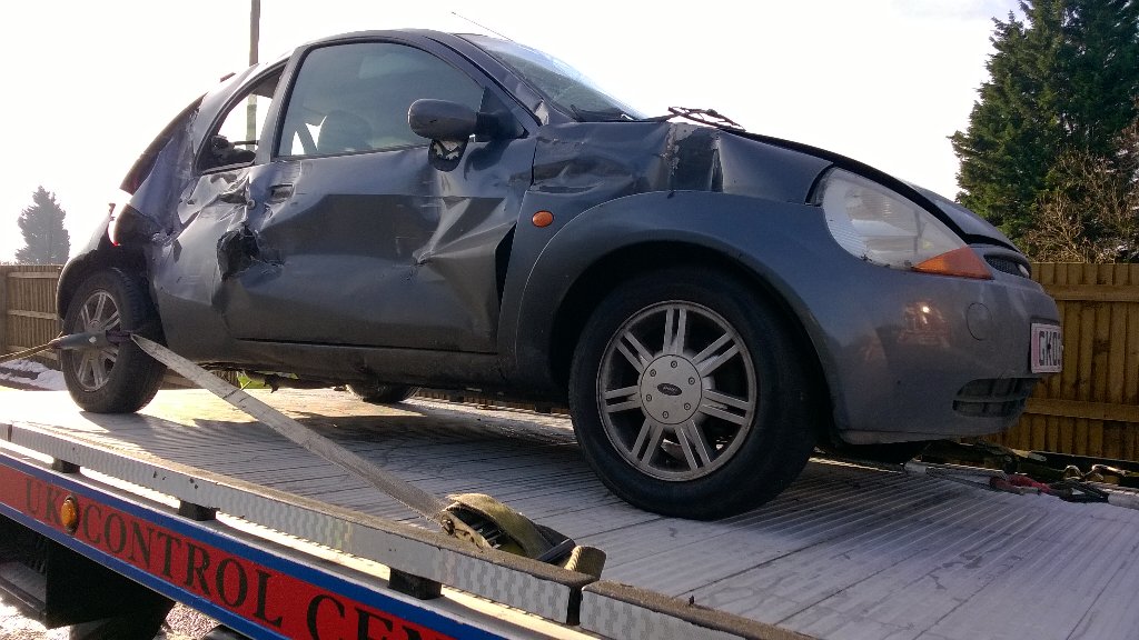 roadpoliceBCH's tweet photo. Use your phone whilst driving and your car could end up on a recovery truck also. Driver on route to A&amp;E 411381/2760 https://t.co/VRCWBr5rG8