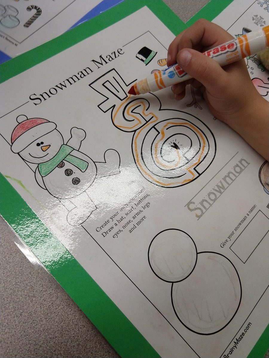 Working on fine motor skills in Kinder.