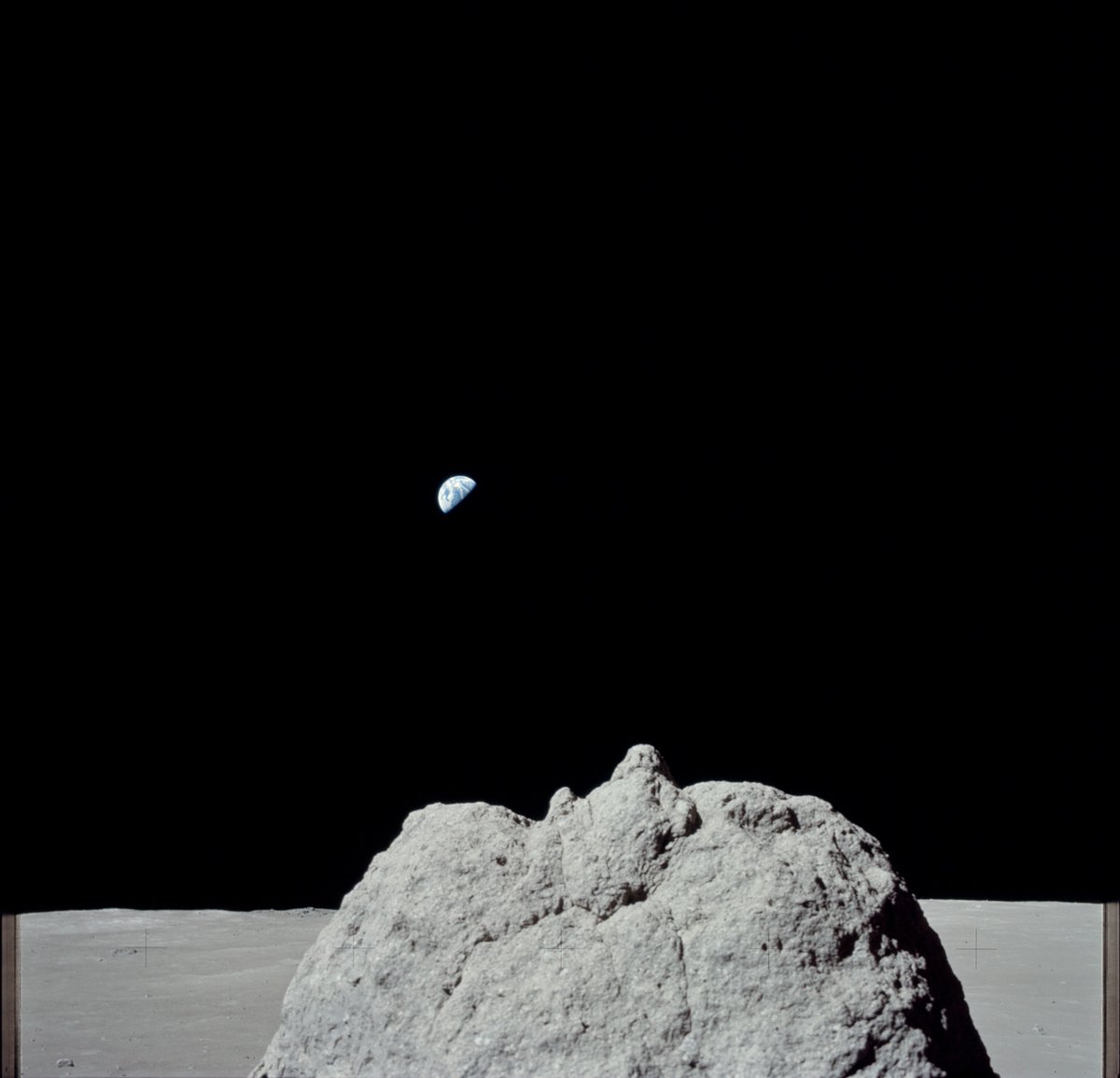 Rainmaker1973's tweet photo. View from Station 2, Sample 2315, boulder, and distant Earth taken during the second Extravehicular Activity EVA 2 of the #Apollo17 mission. Exactly 45 years ago #Today https://t.co/Cf58z4TpyY https://t.co/o4gDPQEYR8