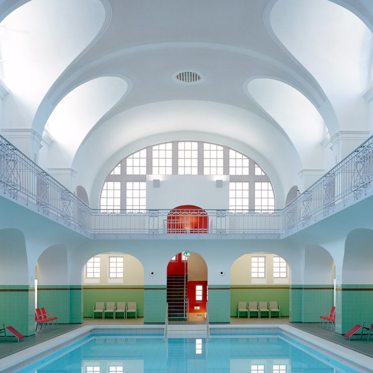 Veauthier Meyer Architekten’s 2014 overhaul to the 1909 Gotha Municipal Pool in Thuringia, Germany, introduced a new sauna wing and competition pool, while the original lap pool (pictured), with its ceiling arches and wrap-around mezzanine, was unobtrusively restored