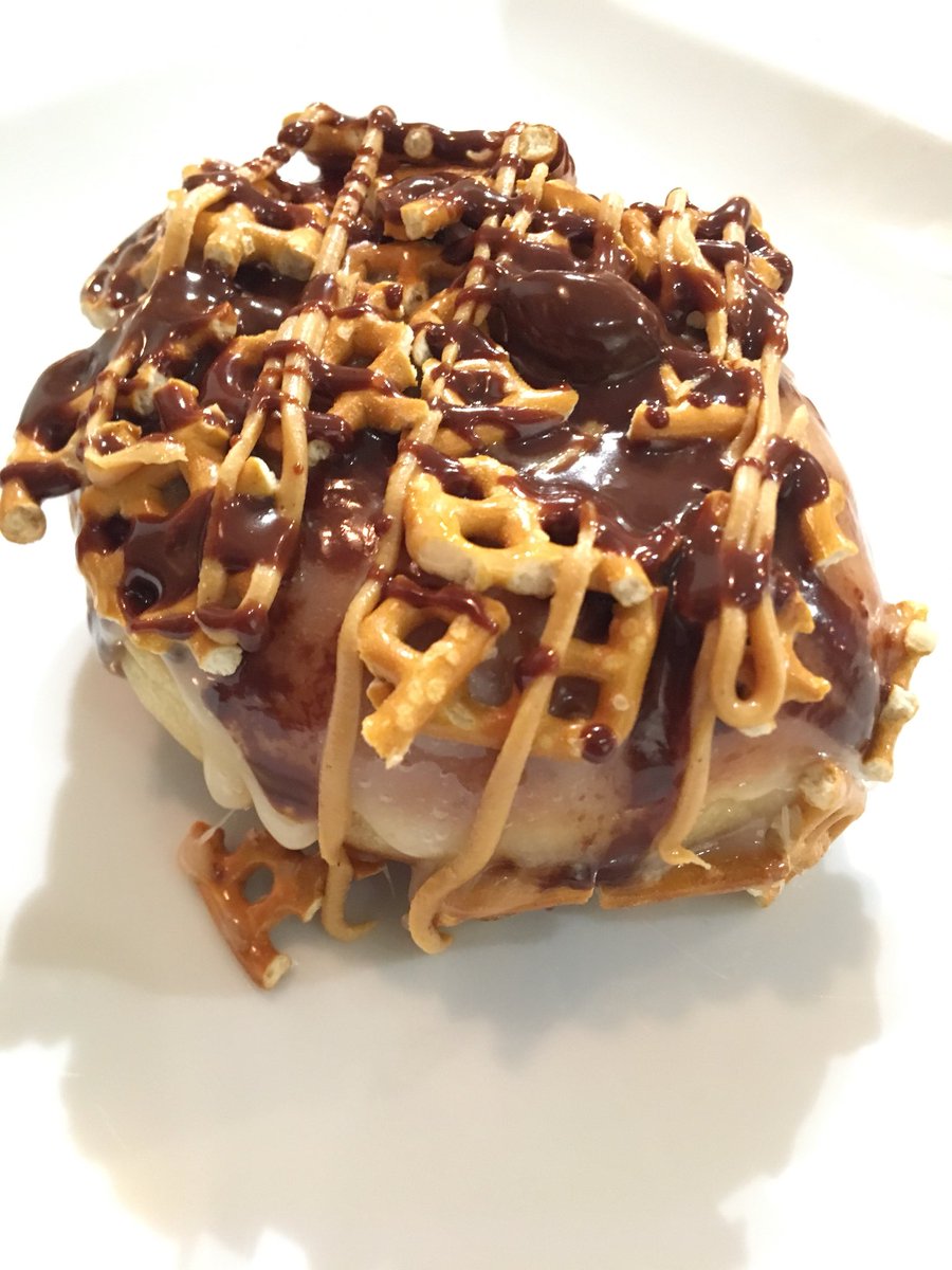 Welcome to our donut family “The Salted Dawg” it’s marshmallow glaze, peanut butter, ganache, and pretzels.  In our East Lansing bakery today and at both locations starting tomorrow.