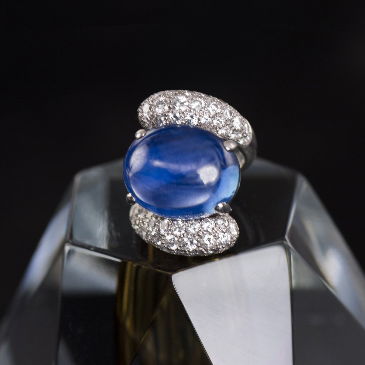 Celebrate the holiday in style. Cabochon sapphire and diamond ring by Paul Flato. #retrojewelry #FredLeighton