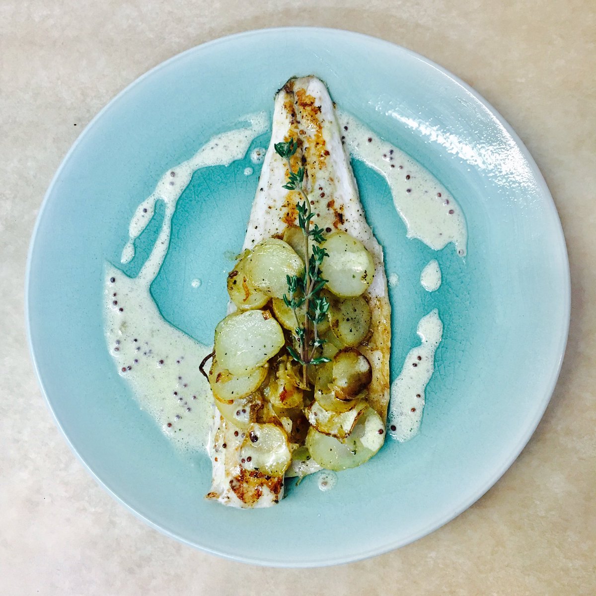 A petit special this evening for our 'Two's company' evening. Sea bass fillet with pommes Lyonnaise &amp; a Mustard Cream Sauce. Bon appetite 🍽🇫🇷