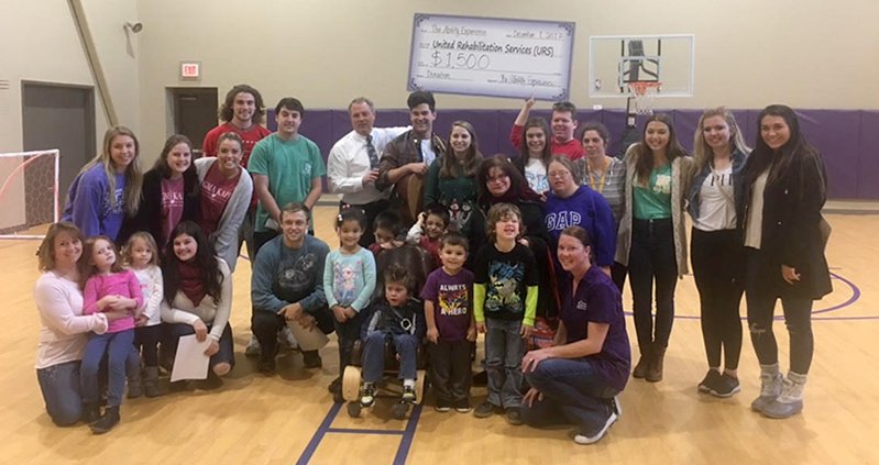 Iota Pi (<a href="/DaytonPiKapp/">UD Pi Kappa Phi</a>) brothers went caroling with Alpha Phi and Sigma Kappa at United Rehabilitation Services and presented a check for $1,500. starandlamp.com/index.php/feat…