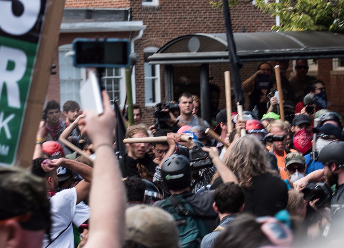 ReportField's tweet photo. @BasedHooter @ProPublica #Antifa #Blacklivesmatter beating old guy on ground with flagpole #UTR rally #Charlottesville https://t.co/XnsuTGBg7v