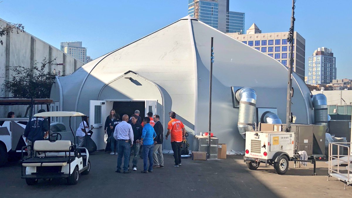KPBSnews's tweet image. The first of three new temporary #homeless shelters is now open in downtown #SanDiego. The tent shelter will house up to 350 people 
kpbs.us/2ACq4eQ
