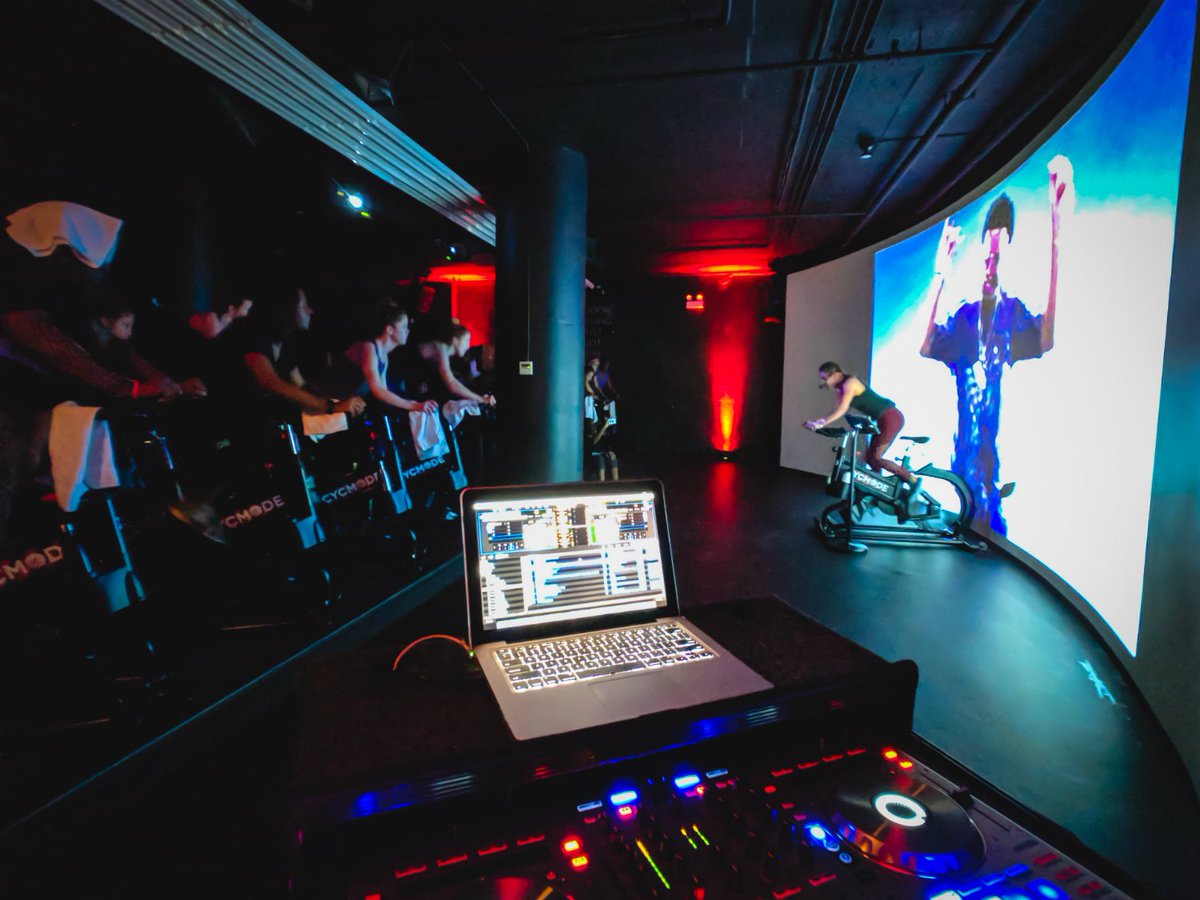 Mode_Events's tweet image. Immersive cycling class taught by the talented @kaileetrains. Held at the state-of-the-art studio @cycmode w/ 50 Foot curved screen and @mode_events LIVE VIDEO DJ'ing. Follow @kaileetrains &amp;amp; @cycmode for info on the next class! #modeevents #videodj #dj #spinclass