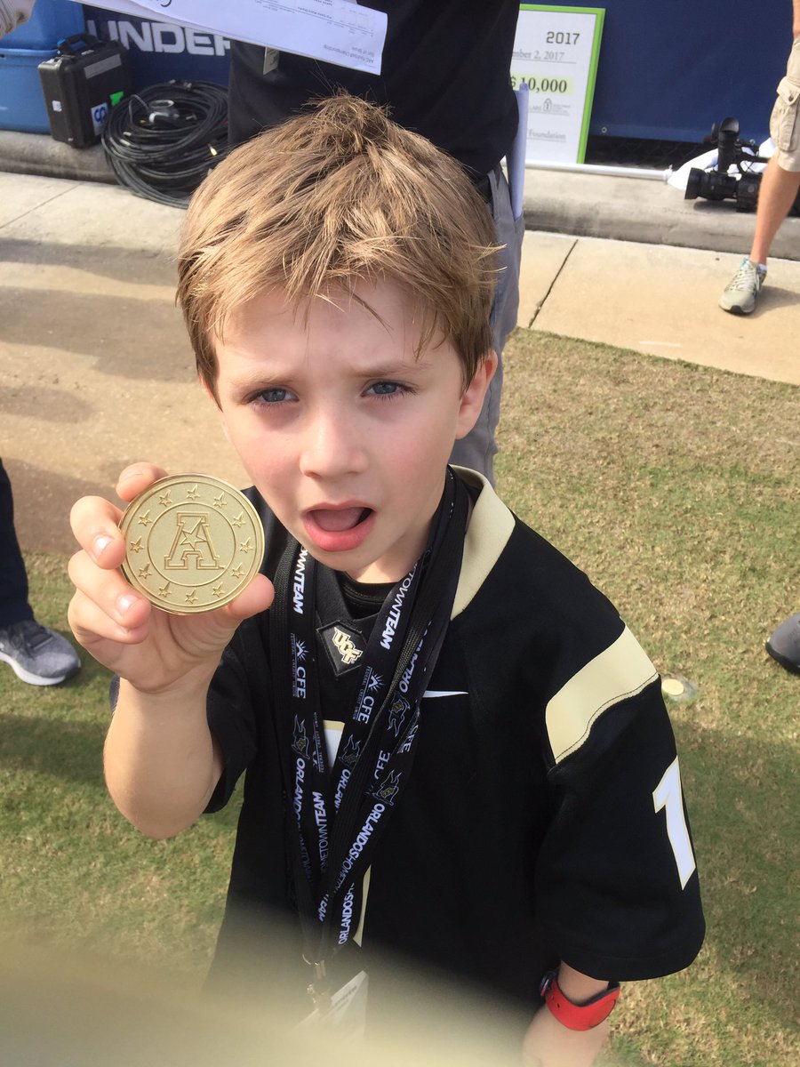 TwinkleToesSSI's tweet photo. Walker got to keep the coin from the @UCF_Football championship! #ATLBound #CFPSucks https://t.co/7B05ufYLYq