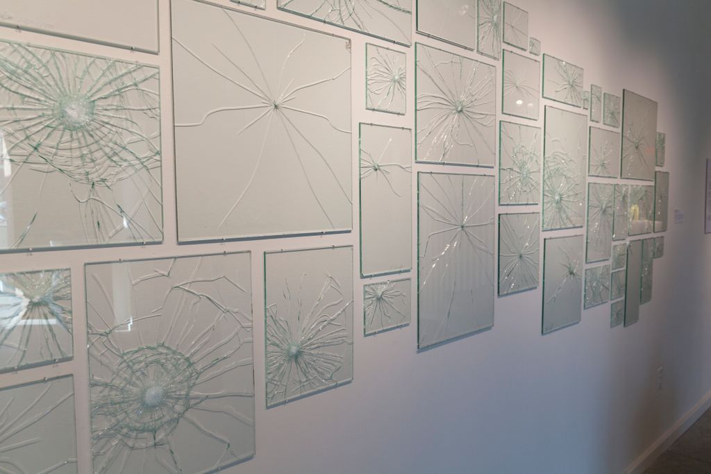 'Portraits in Glass' by Sarah Vaughn is an ongoing installation of nontraditional abstracted portraits of people with whom she has crossed paths. Like photographs, these panels can capture the emotions of their subjects as they strike the glass.