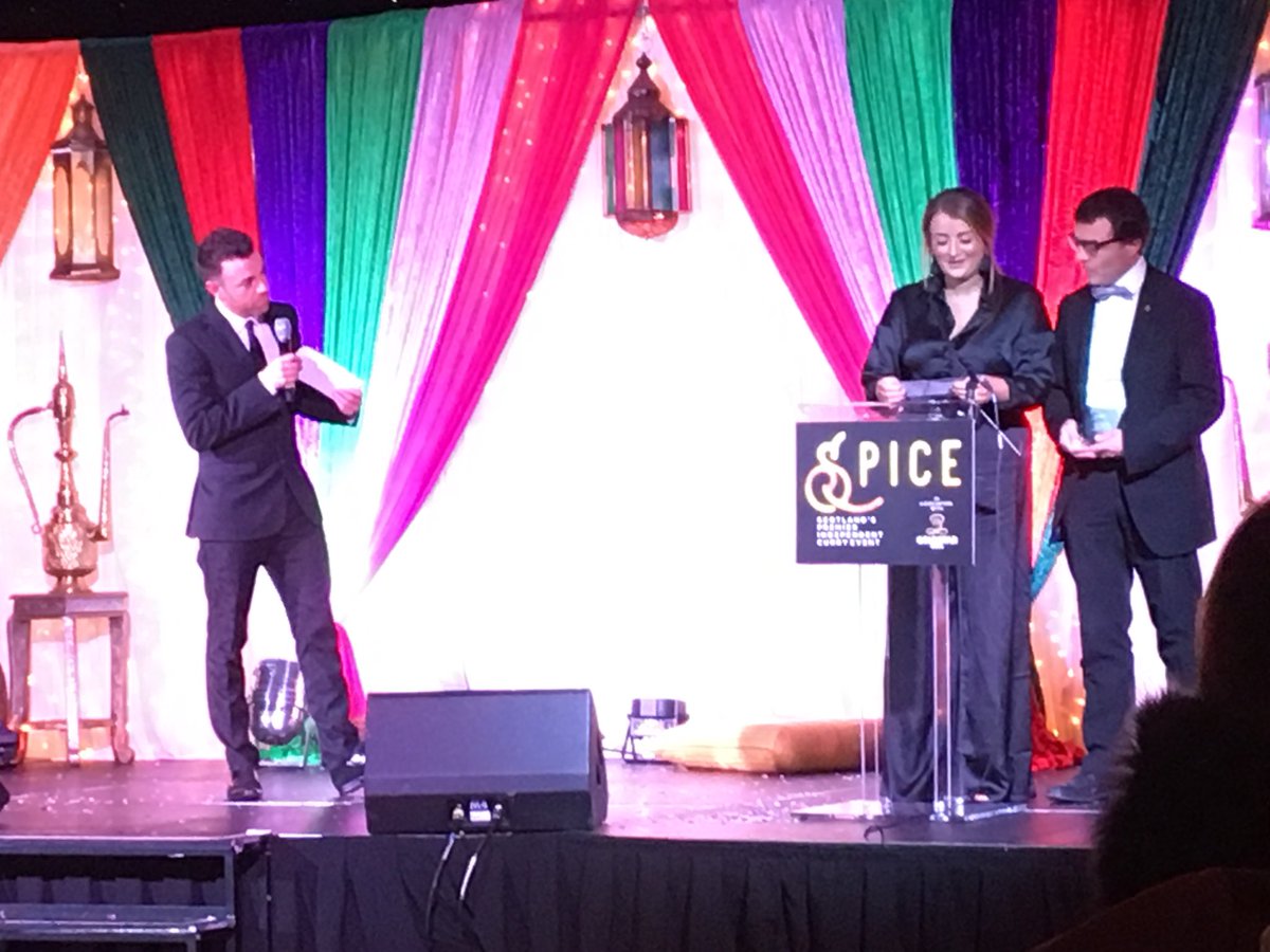 Dunnswholesale's tweet photo. Great job from our very own Key Accounts Manager Rachel Hay and @DunnsDavidR announcing @qismatelgin as Scotland’s Favourite Curry House at @spiceawards with tonight’s amazing host @des_clarke https://t.co/qLIy7YVlN8