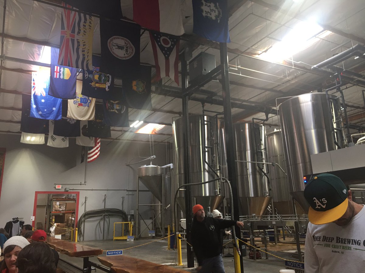 J_A_Shepherd's tweet photo. @KneeDeepBrewing for a flight and spicy dog ... yum ... note Aus flag in light .. also Korean flag further back https://t.co/RfIGOv3jrv