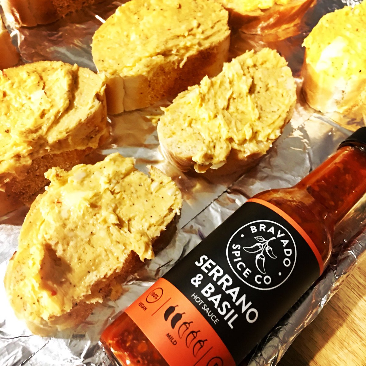 Serrano &amp; Basil Hot Sauce infused garlic bread.  Mix our hot sauce into your garlic butter before baking &amp; eat like a king/queen when done. #TeamBravado bravadospice.com/shop/