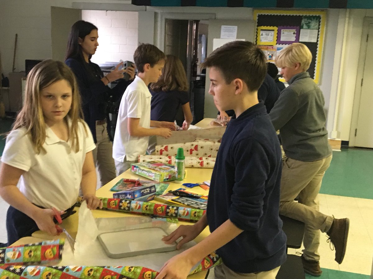 NBMS Junior Civitan wrapping gifts for the Wonans Shelter