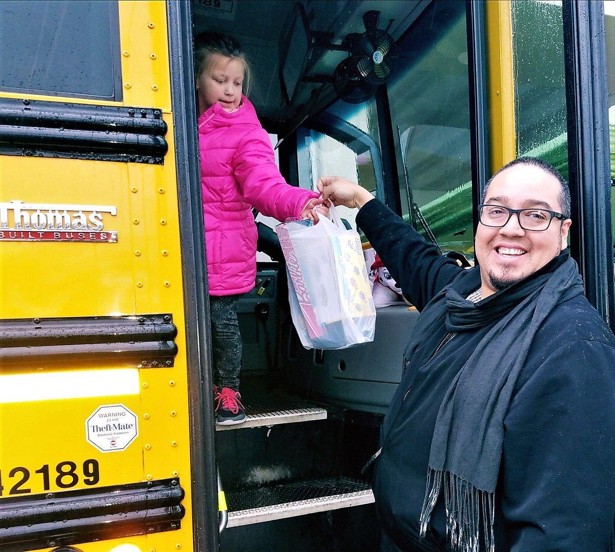 BaysideALF's tweet photo. @Bayside_Terrace Holiday cheer is in full swing as (Life Enrichment Coordinator) Juan adds some gifts to 'stuff the bus' for the annual CB/NB Rotary Bus Jam! https://t.co/pux3xf5UrY