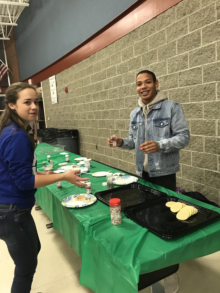 NHSSHHS's tweet photo. Our treasurer Ryan helping decorate cookies at Black Elementary’s PJ’s and Pizza Party! https://t.co/9iPbI4nz7N