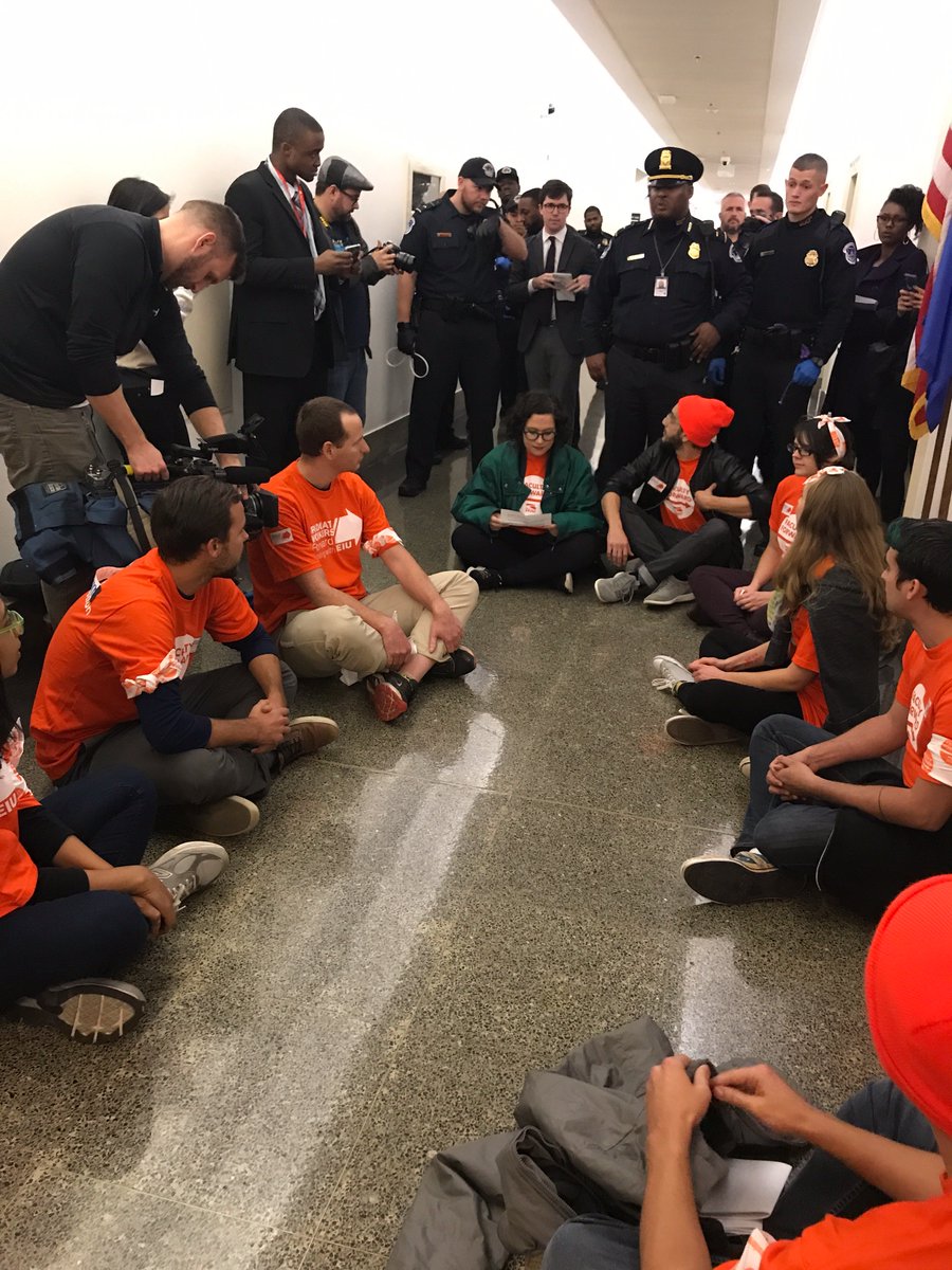FacultyForward's tweet photo. 9 arrested at @speakerryan's office for protesting the #goptaxscam #riseup https://t.co/bwzri2tFUr
