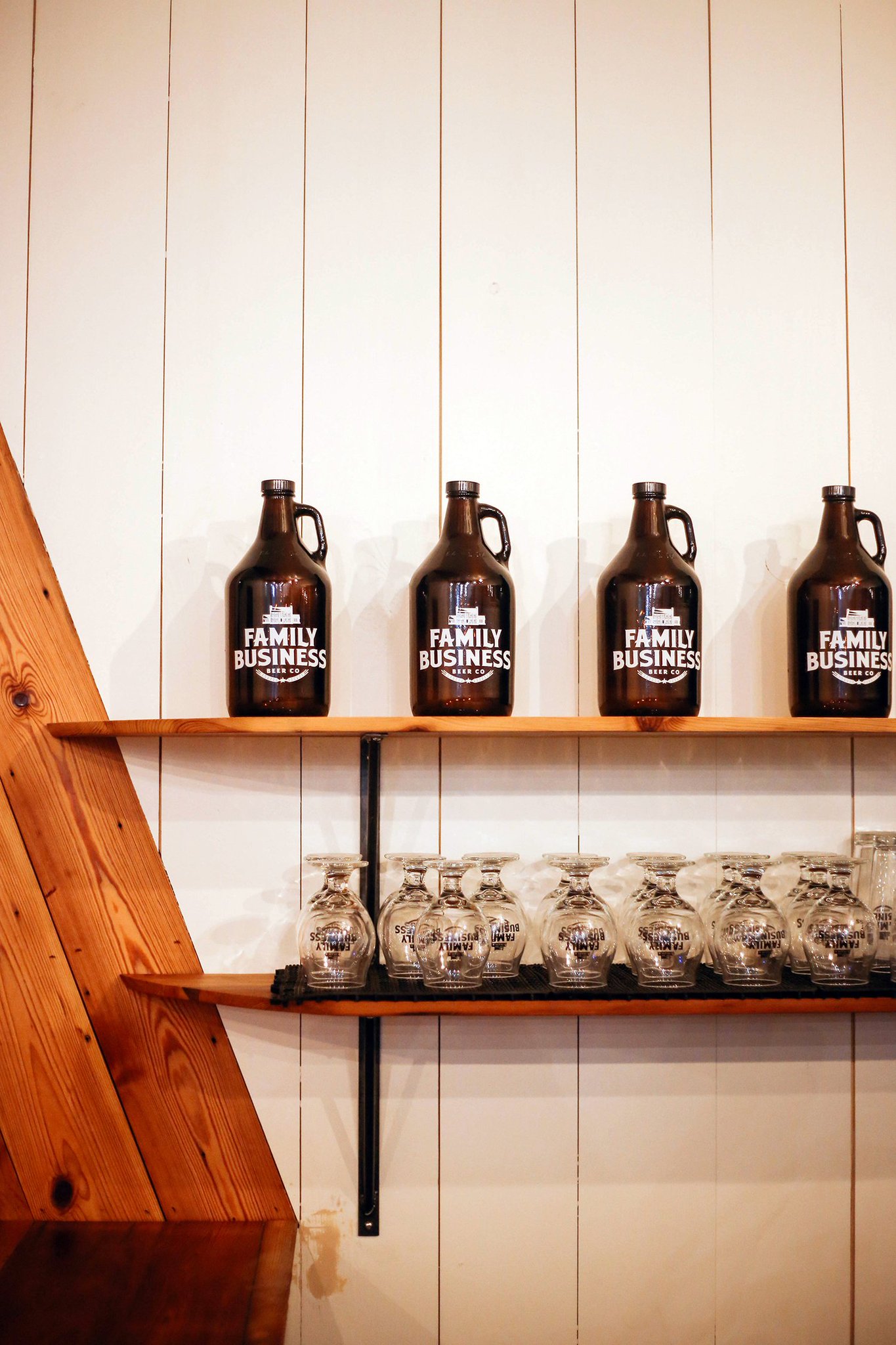 glasses and growlers on display at the Family Business Beer Company