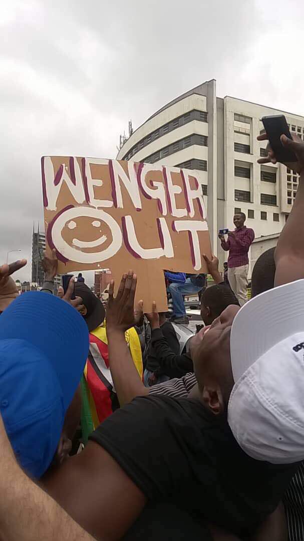 stanleykwenda's tweet photo. Saw this #WengerOut placard two weeks ago at #Zimbabwe #Mugabeout protests https://t.co/09K02QirTd
