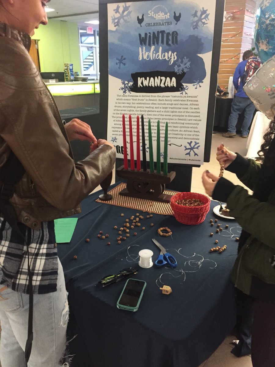 BlueHenMaggieQ's tweet photo. Here at the Kwanza table, you are able to bead a bracelet #UDevents https://t.co/4IO6MxRWFJ