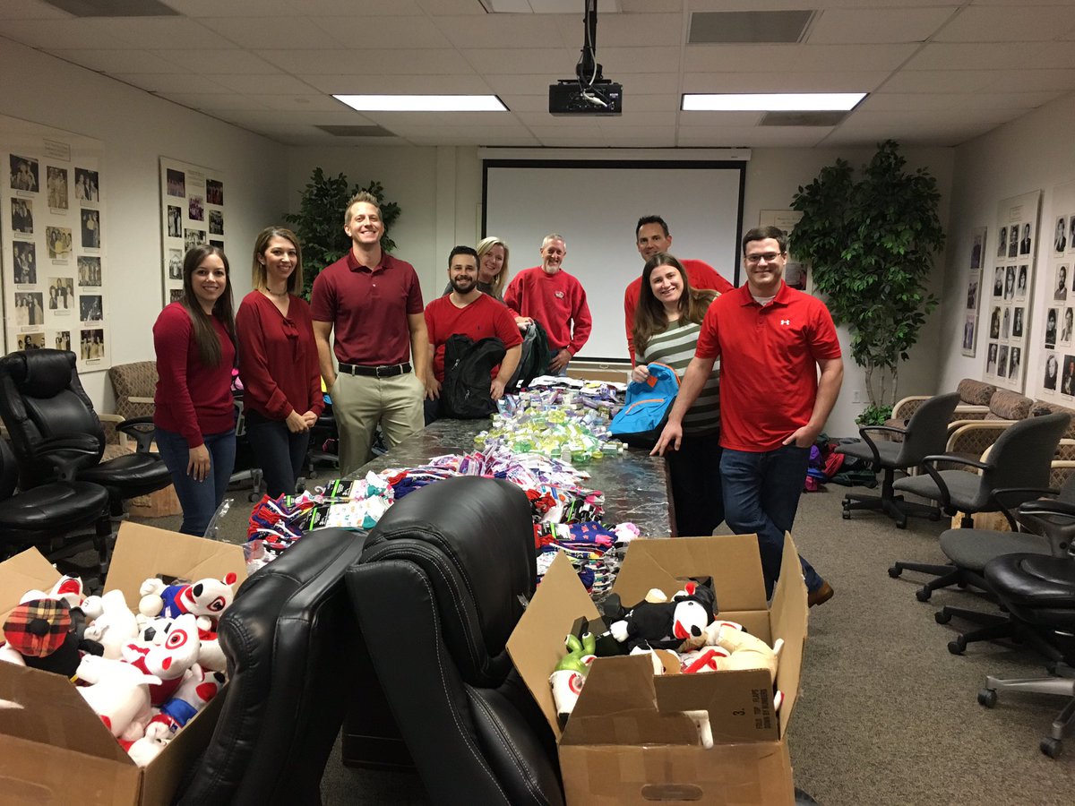 D377 elves helping Santa stuff backpacks for Child Help!