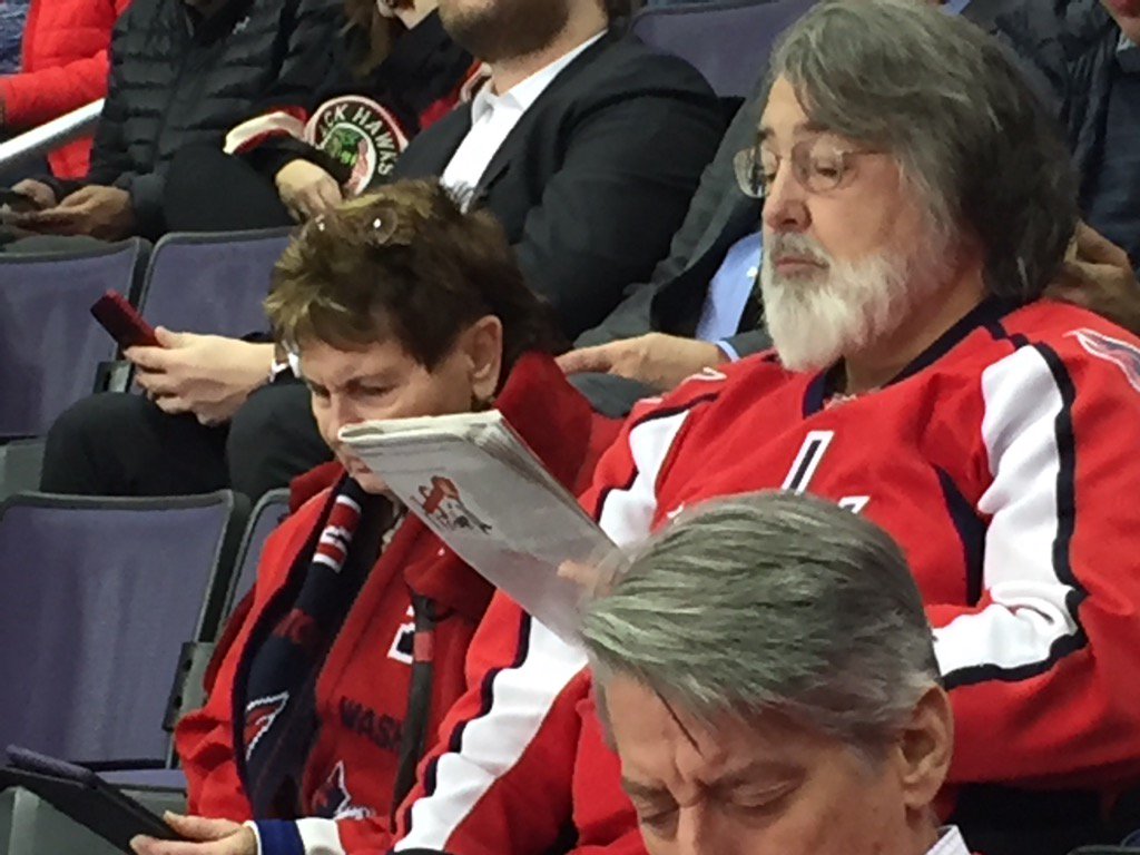 paulemcgowan's tweet photo. #itsaDCthing dude reading @TheEconomist during first intermission #letsgocaps https://t.co/TXtBwqk1WG