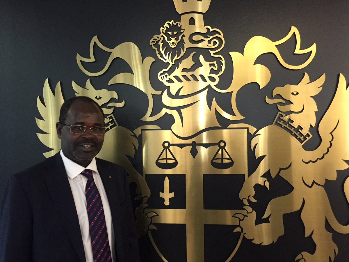 KenyaBankers's tweet photo. @kenyabankers CEO @HabilOlaka at the entrance of the London Stock Exchange when he visited this year with the #GreenBondProgram & @ClimateBonds. The words “Dictum Meum Pactum” stand for “My Word is My Bond.” #TBT https://t.co/MJvGjrj8cl