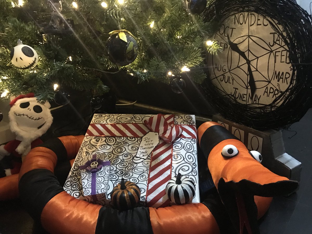 HexManiacKarina's tweet photo. I usually put the gifts out closer to Christmas but I wanted to showcase the Tree Eating Snake I made sooooo I put one out 🖤 #NightmareBeforeChristmas #treeeatingsnake #handmadebyme #sandyclaws https://t.co/xcKTWBB1no