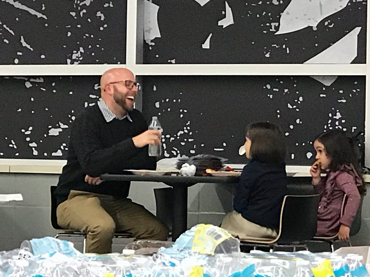 MommaMode2's tweet photo. These two little girls literally booted a big girl from the table to join coach for dinner...adorable!! https://t.co/wF9pkFU1l2