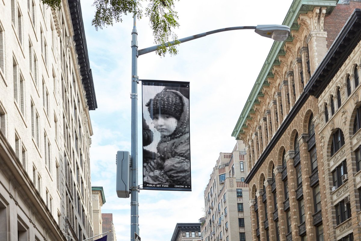 PublicArtFund's tweet photo. 200 portraits on lampposts span the city as part of @aiww’s #GoodFences. Learn more about the images and where you can view them https://t.co/nTmUCSflPO #PAF40 https://t.co/l5I2r9kdIa