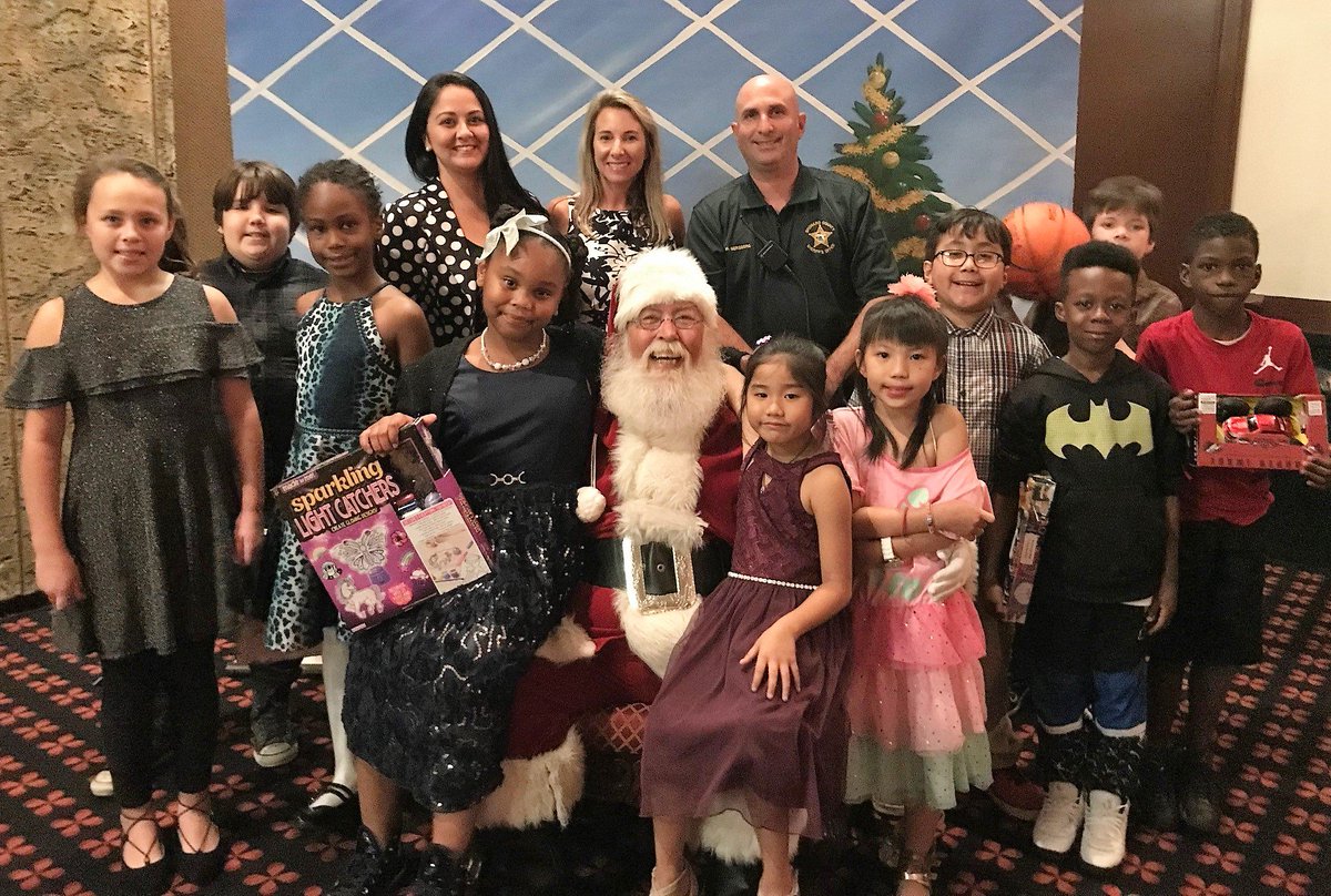 CooperCityGOV's tweet photo. The Davie-Cooper City #Rotary Club brought holiday cheer to some very special #Davie and #CooperCity students who enjoyed Christmas carols, gifts, snow and a lunch with #Santa at the #SignatureGrand in Davie. https://t.co/jF4nUHAsRJ https://t.co/2UZpTTtsz4