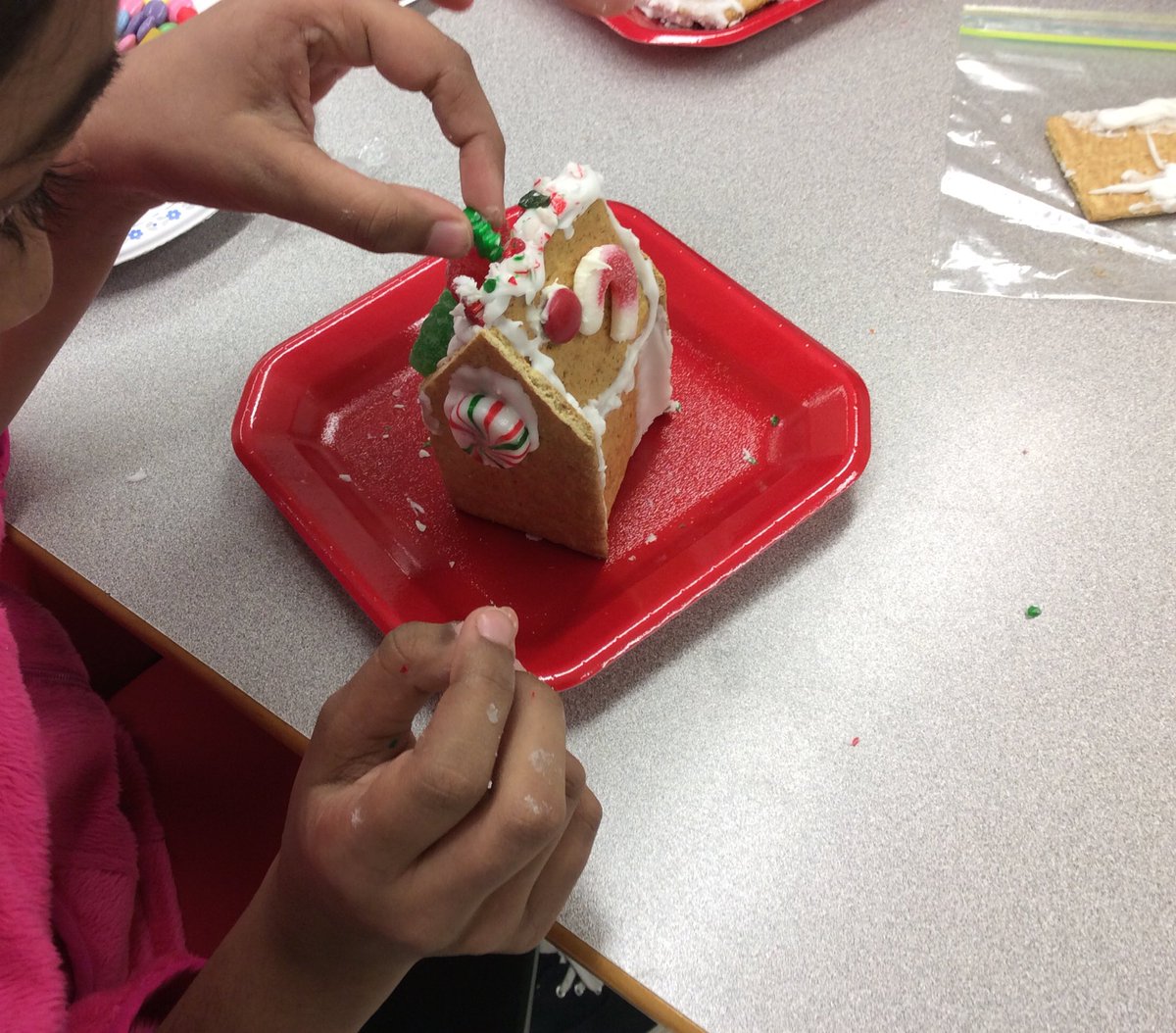 Ms_Croucher's tweet photo. @SpringdalePS1 Since Ms. Croucher didn't have enough of each ingredient to make cookies, we used them to make gingerbread houses instead! #proceduraltexts https://t.co/w9sbGgWR3u