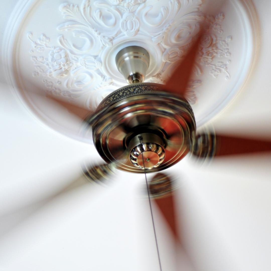 It's time to reverse your ceiling fan. When the fan blades rotate clockwise, they push the warm air down to reheat the lower areas.