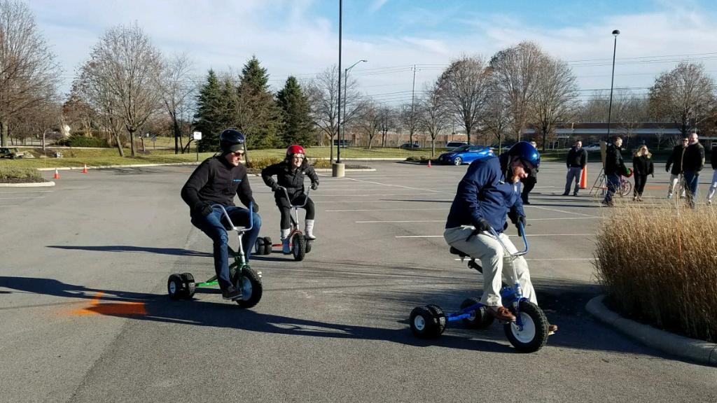 .<a href="/UHC/">UnitedHealthcare</a> employees in Columbus converted the parking lot into a tricycle race course to raise funds for @BikeLadyInc, an Ohio nonprofit providing bicycles for children in Ohio foster care.